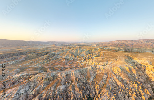 Wallpaper Mural Goreme, Nevsehir, Turkey. Wide panoramic aerial view of Devrent Valley at summer sunset. Volcanic tuff cones and eroded fairy chimneys shaped by wind and water. Aerial view. Torontodigital.ca