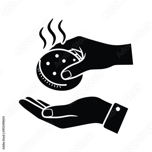 Two hands, one holding a steaming food item, the other cupped to catch it.