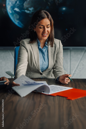 Businesswoman presenting documents during a corporate meeting