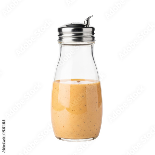 A glass bottle of creamy salad dressing on transparent background