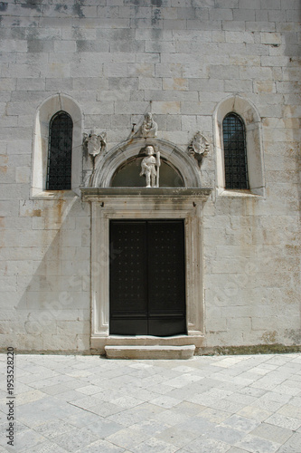 Photography The renaissance portal of the Church of Saint Roch in Korcula features a statue