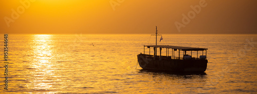 Beautiful Sea of Galilee in the morning. Golden sunrise over Kinneret