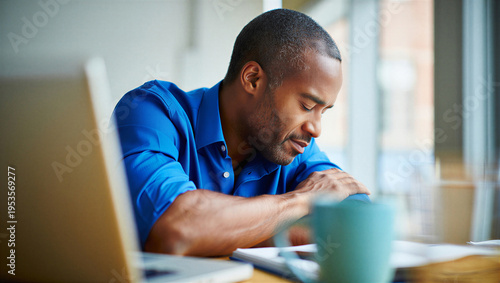 Mid-career adult learner surrendering to acute mental exhaustion over open study materials after extended screen time.