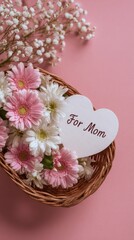Basket of pink and white flowers with heart card reading For Mom ideal Mother's Day gift