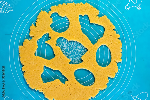 Easter cookie crafting involves creating festive treats by cutting shortcrust dough into traditional shapes like bunnies, eggs, and chicks using special cookie cutters, following detailed traditional 