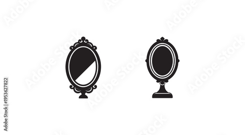Two black and white ornate mirrors on stands with intricate designs and oval shapes  reflecting nothing