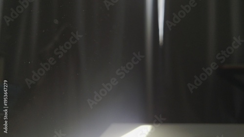 Schilderij op canvas Atmospheric Sunlight Beam with Floating Dust Particles in a Dark Room