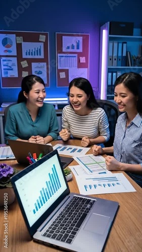 Wallpaper Mural Diverse team celebrates success, analyzing charts in a modern office at night, collaboration and achievement Torontodigital.ca
