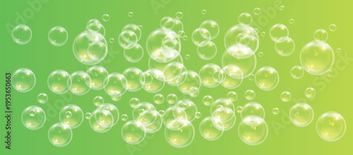 Bubbles floating on green background 