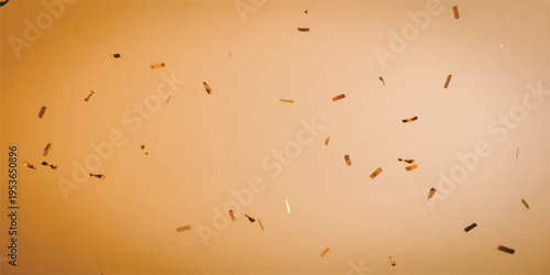 Macro shot of tiny specks or dust particles floating on a warm, soft, out-of-focus background, beige background