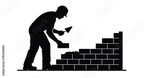 A silhouette of a mason building a brick wall with mortar