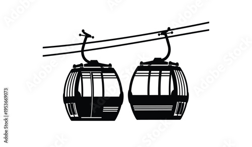 Silhouette of two cable cars or gondolas on a cable line