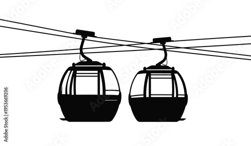 Silhouette of two cable cars or gondolas on cables against a white background