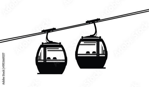 Silhouette of two cable cars or gondolas on a cable line