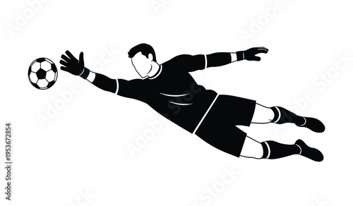 Soccer goalkeeper in diving silhouette saving ball
