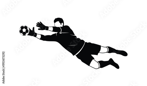 Silhouette of a soccer goalkeeper diving to make a save in a game