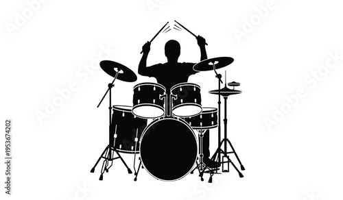 Silhouette of a drummer playing a drum set with dynamic sticks