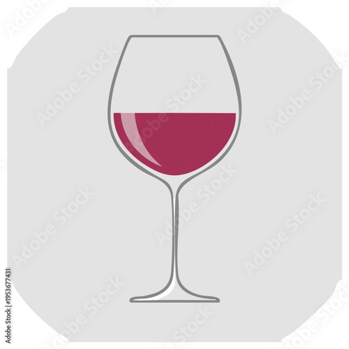Elegant wine glass filled with deep red liquid on a muted gray background