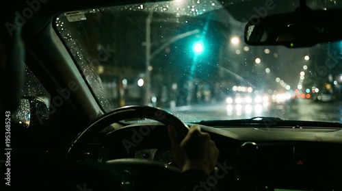 Nighttime View from Windshield with Traffic and Green Light in Urban Setting