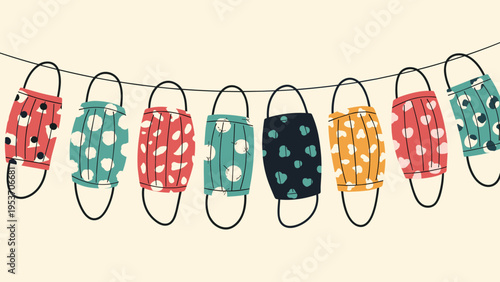 Row of various colorful handmade fabric face masks with different patterns and dots hanging together on a thin black string for protection.