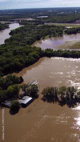 Vertical Aerial Drone View of River Flooding Farmland and Trees