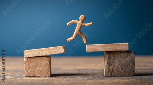 Wooden figure jumping over gap opportunity bridge risk challenge success motivation determination overcoming obstacle blue background concept