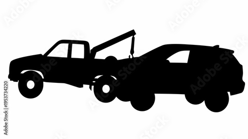 Silhouette of a tow truck towing a broken car on the roadside at night