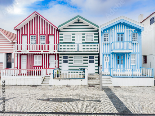 Colourful striped beach houses in Costa Nova do Prado, Aveiro, Portugal.