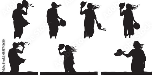 Silhouettes of people holding hats in windy conditions