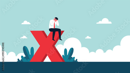 Stressed businessman sitting on a large red cross mark representing failure, rejection, or an incorrect business decision.