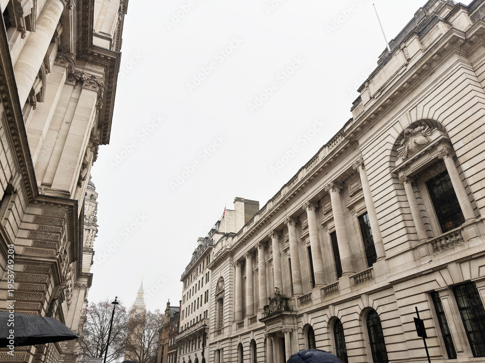 Obraz premium Historic Institution of Civil Engineers government architecture on a cloudy street in London, UK with Elizabeth Tower