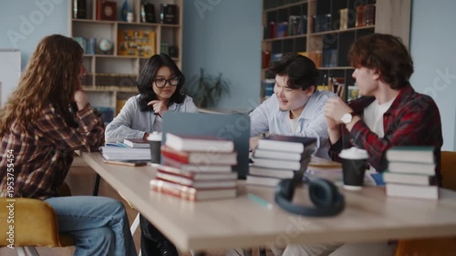 Diverse students collaborating on a group project in a university library