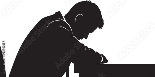 Silhouette of a man sitting alone at a table