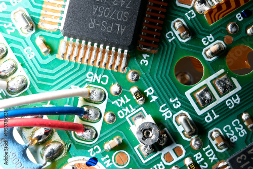 Intricate details of a colorful circuit board under bright lighting