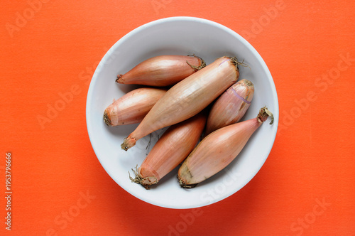 Fresh homegrown organic Shallots in Bowl top view