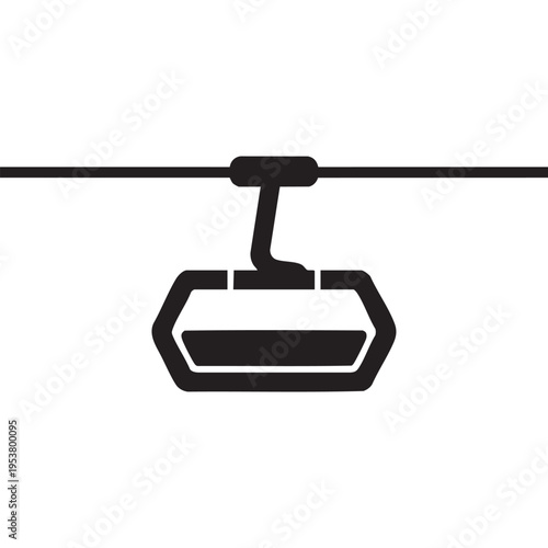 Aerial tramway gondola travels along cable suspended high above mountainous terrain in a scenic landscape with a transportation system.