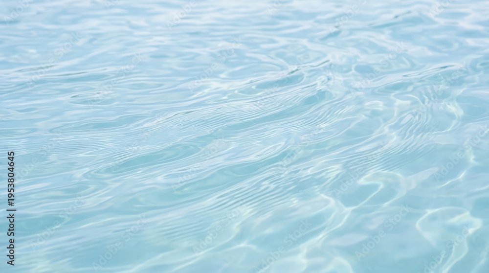 Fototapeta premium Calm and Clear Blue Water Surface with Gentle Ripples and Reflections