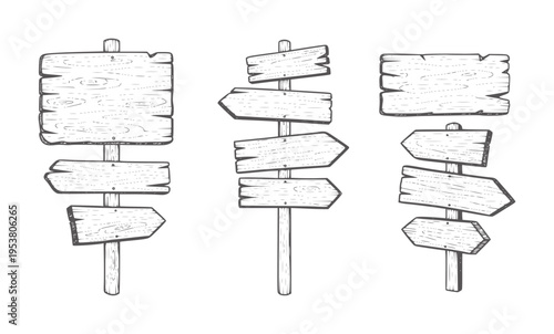 Rustic wooden directional signposts with multiple arrows in black and white directions