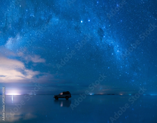 Majestic night sky with milky way star reflection in Uyuni, Bolivia