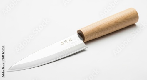 A pristine Japanese chef knife with a sharp steel blade and wooden handle.