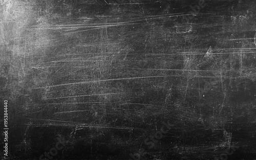 Chalk rubbed out on blackboard background. often with faint chalk smudges, used for educational.