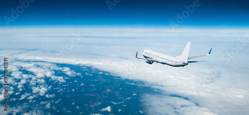 Foto Airplane flying in the sky over the land surface, white commercial airplane in t