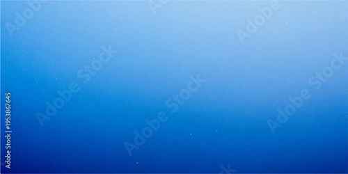 A vintage blue grunge background with a textured paint pattern on an aged paper surface provides a dark yet bright blank canvas design for a wall or art backdrop