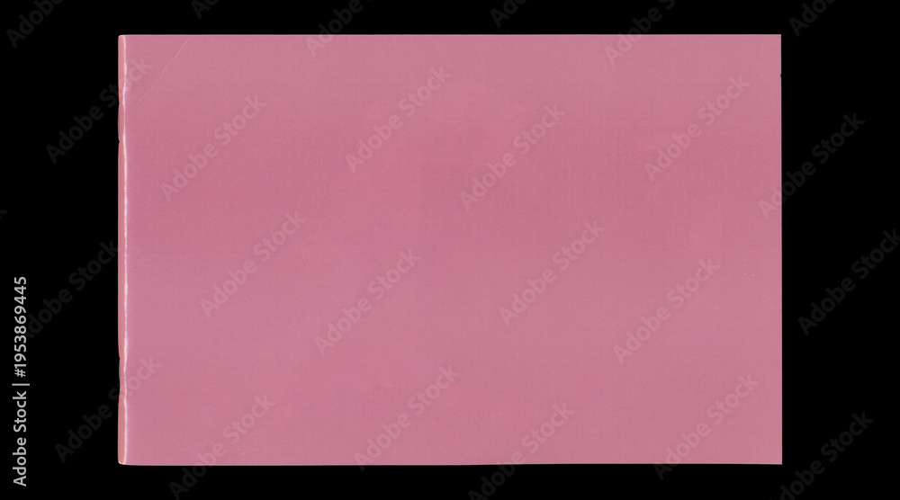 Fototapeta premium Wide closed pink notebook cover on black background
