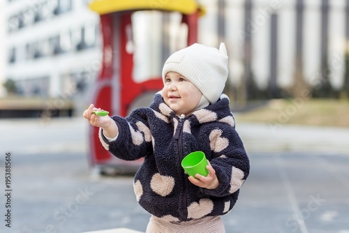 Toddler Playing With Toy At Daycare Playground. Childcare