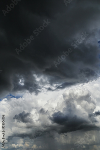 Stormy cloudy dramatic sky with dark rain thunderstorm cumulus clouds background texture