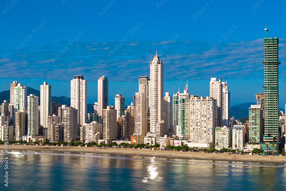 Obraz premium Skyline With High Rise Buildings in Front of the Beach With Blue Sky in Balneario Camboriu City in Brazil