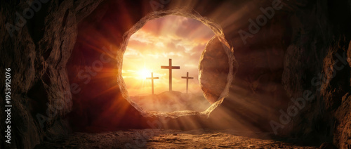 Panoramic wide banner view from inside a dark rocky cave tomb looking out at three crosses on a distant hill illuminated by bright golden sun rays for Christian Easter worship designs.