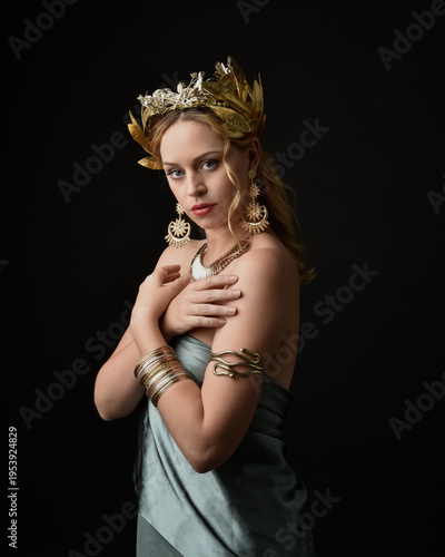 Quadro su tela close up portrait of beautiful blonde female model wearing ancient golden wreath crown, greek goddess costume with ornate jewellery
