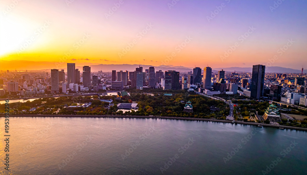Fototapeta premium Osaka bay view of city skyline and castle at sunset